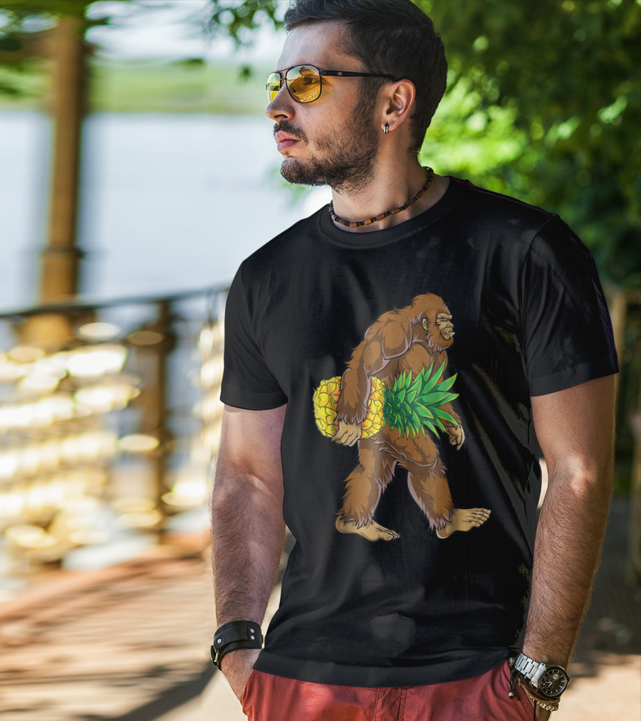 Bigfoot Carrying Pineapple Funny Sasquatch Iconic Creature Humor T-Shirt