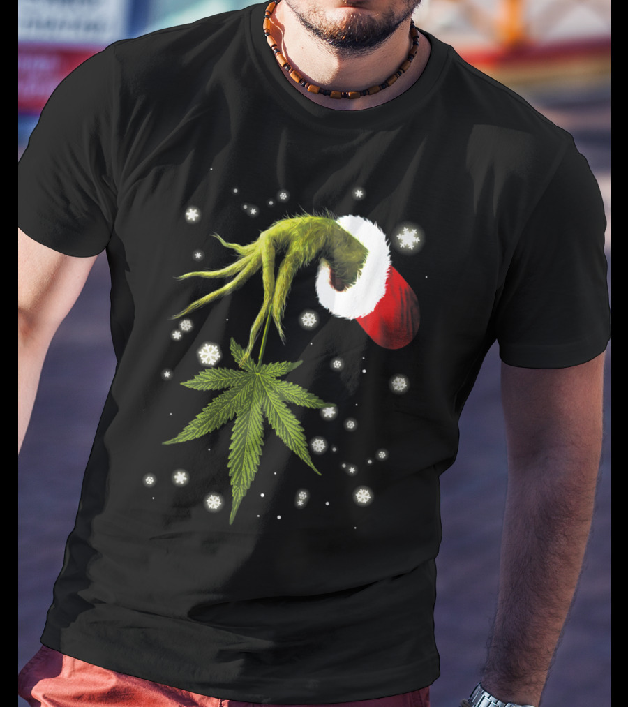 Grinch Hand Holding Cannabis Leaf With Santa Hat And Snowflakes T-Shirt