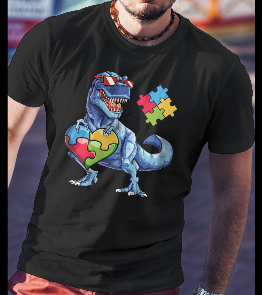 Dinosaur Holding Heart-Shaped Puzzle Pieces Autism Awareness T-Shirt