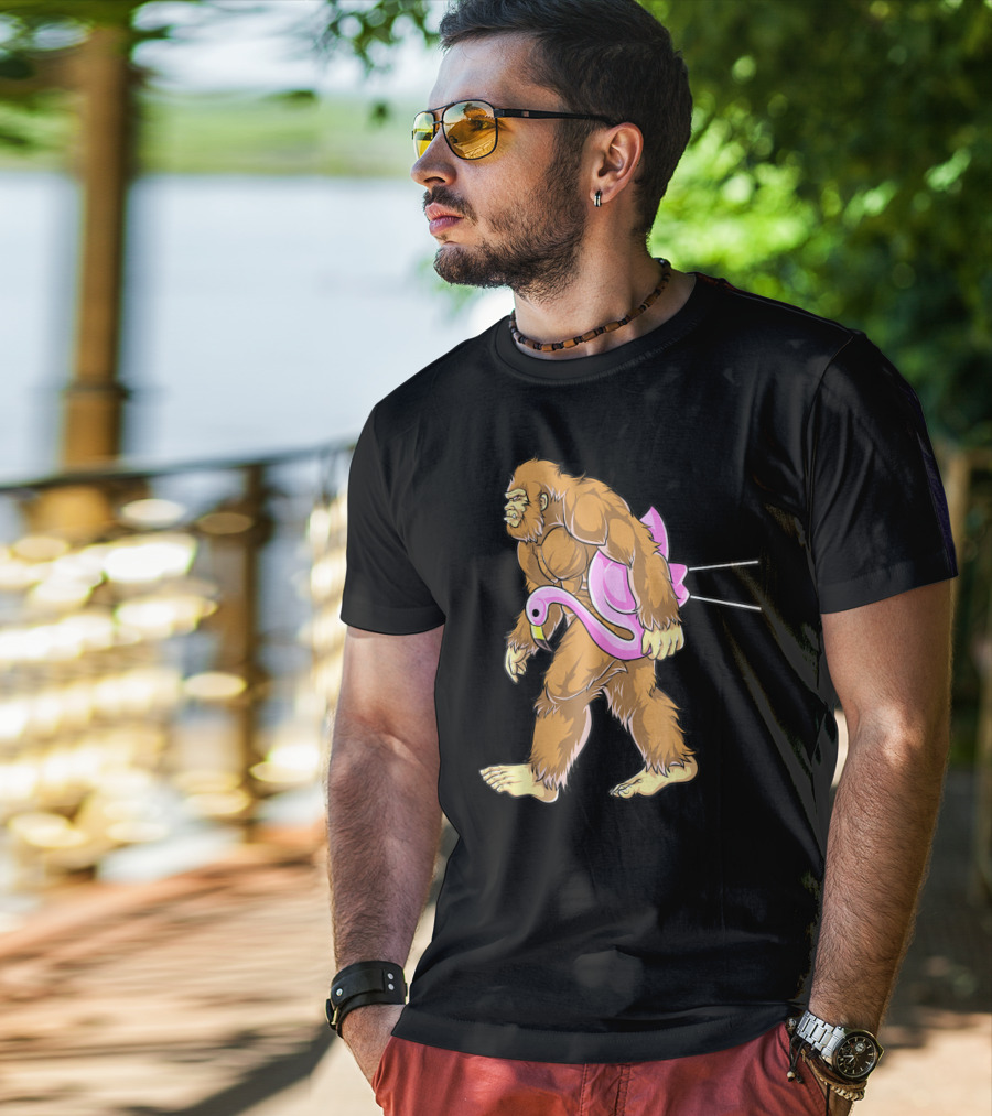 Bigfoot Carrying Pink Lawn Flamingo Humorous Sasquatch Image T-Shirt