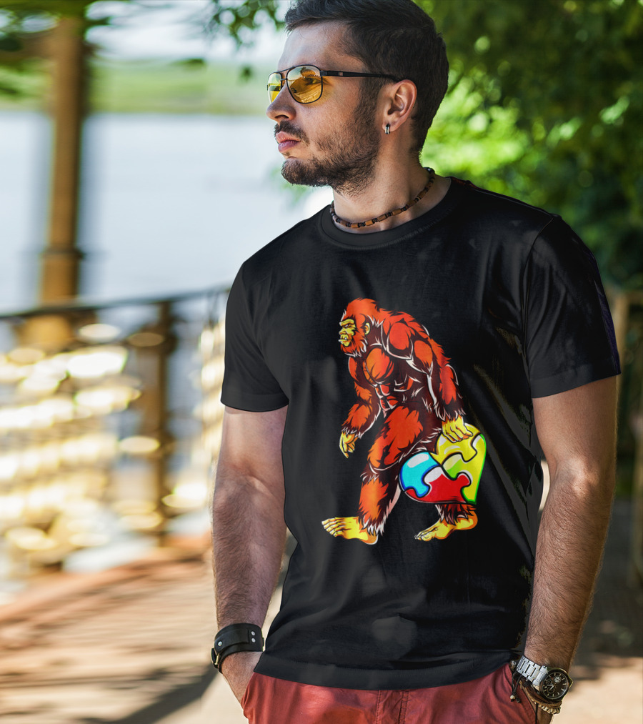 Bigfoot Holding Heart-Shaped Puzzle Piece For Autism Awareness T-Shirt