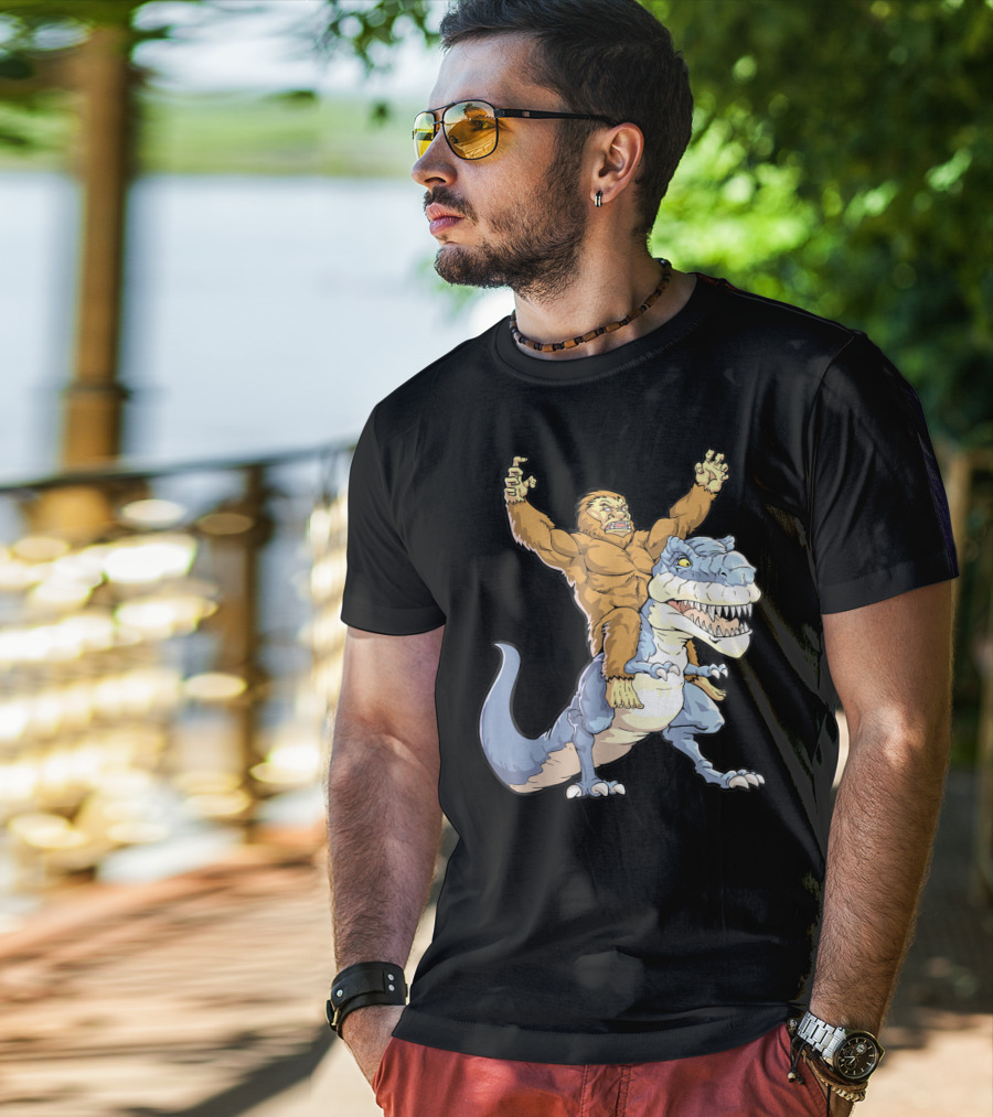 Bigfoot Sasquatch Riding Dinosaur Adventure T-Shirt
