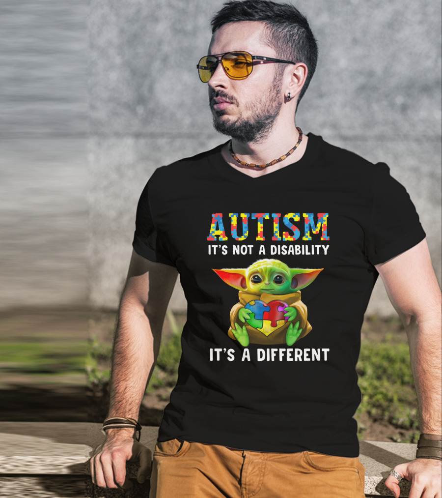 AUTISM IT'S NOT A DISABILITY IT'S A DIFFERENT Baby Yoda Holding Puzzle Piece T-Shirt
