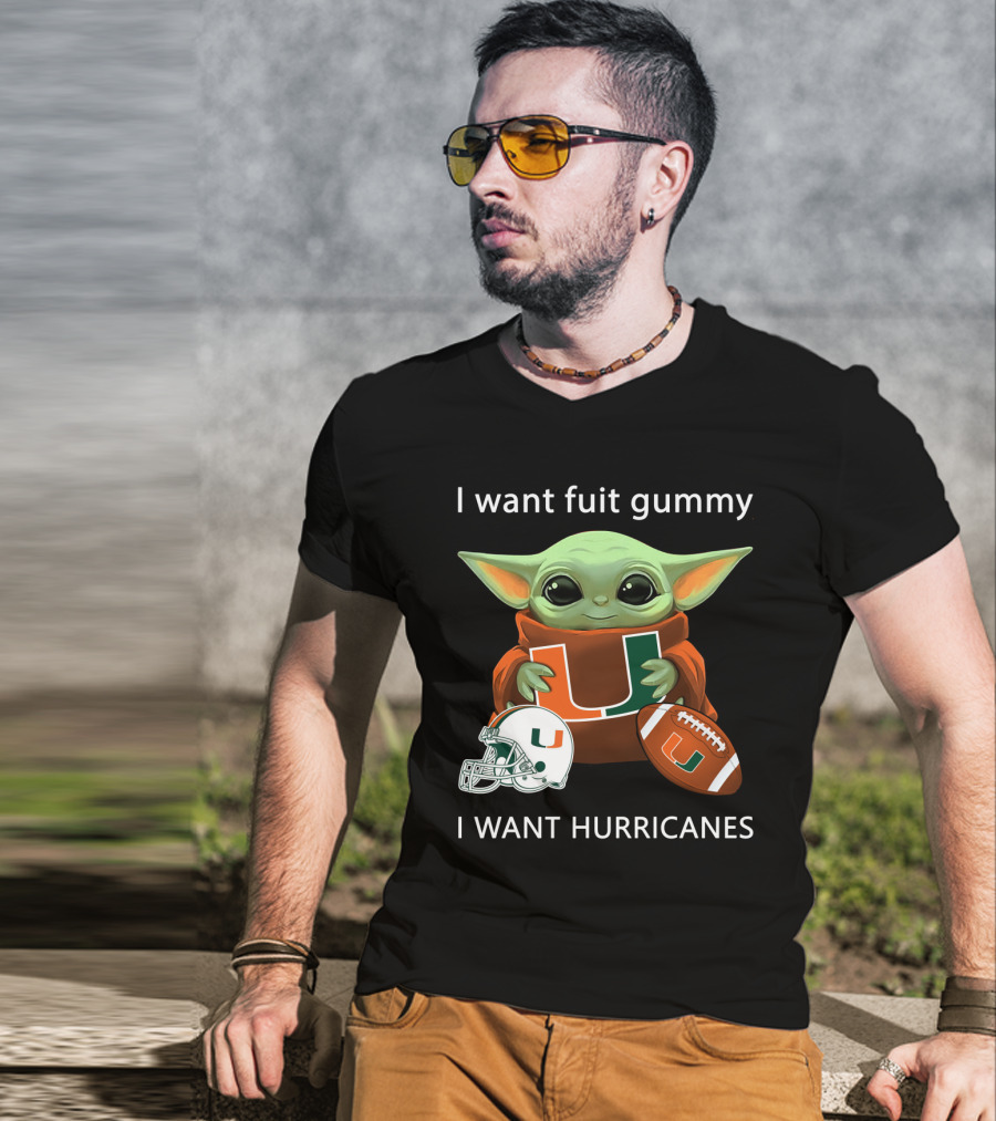 I Want Fuit Gummy I Want Hurricanes Baby Yoda Holding Miami Hurricanes Logo Helmet And Football T-Shirt