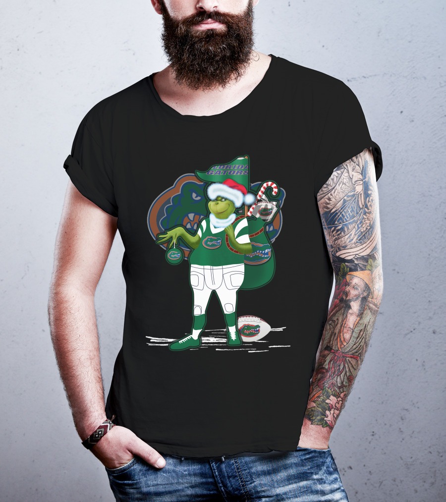Grinchxmas Wearing Santa Hat Florida Gators With Gator Logo And Candy Cane T-Shirt