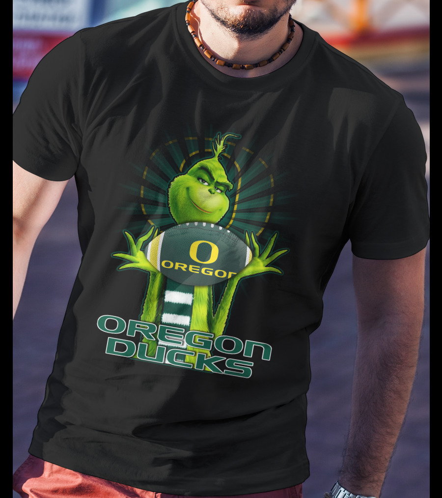 Grinch Holding Oregon Ducks Football T-Shirt