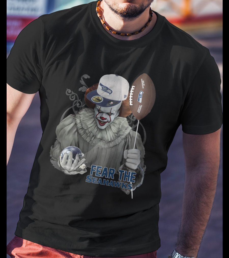Pennywise Holding Seattle Seahawks Football And Wearing Seahawks Cap T-Shirt