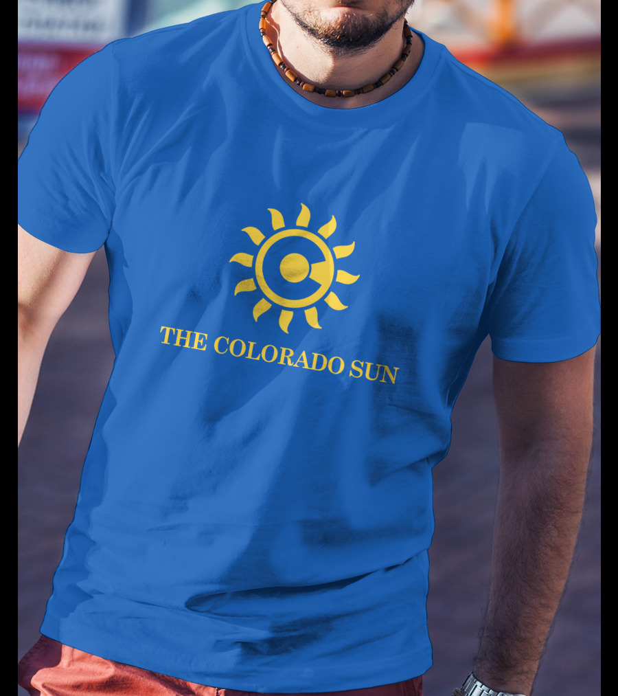 The Colorado Sun Merch Colorado Sun Logo Yellow Sunburst Blue Background T-Shirt