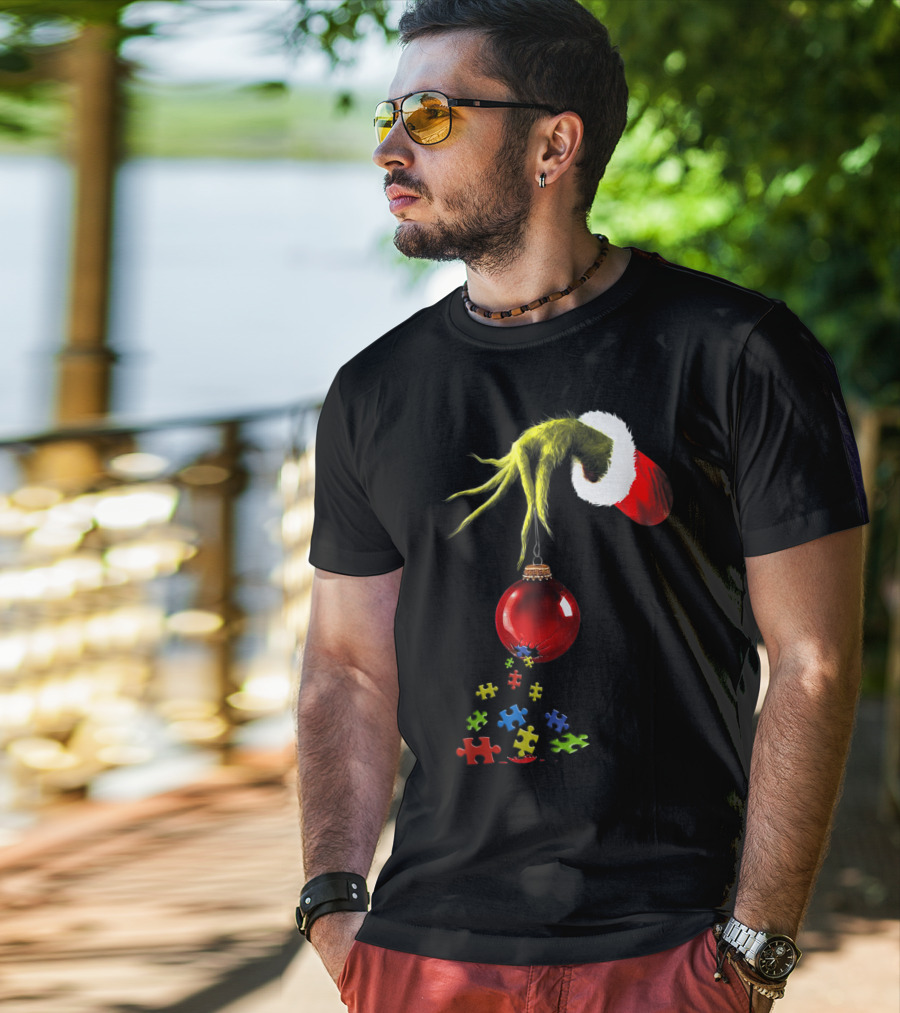 Grinch Hand Holding Red Ornament With Autism Puzzle Pieces T-Shirt