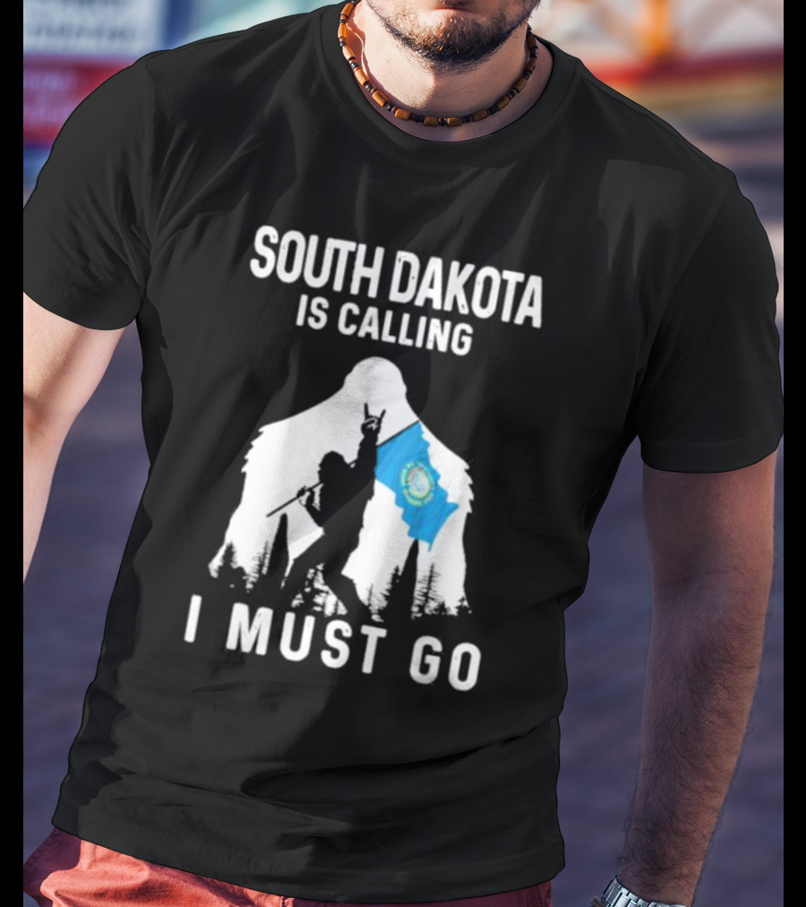 South Dakota Is Calling I Must Go Bigfoot Holding South Dakota Flag T-Shirt
