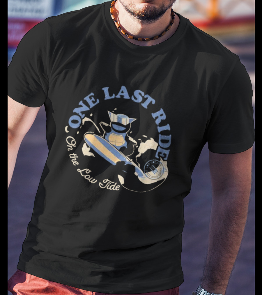 Surfing Adventure With Blue Masked Figure And Iconic Board 'One Last Ride On The Low Tide' T-Shirt