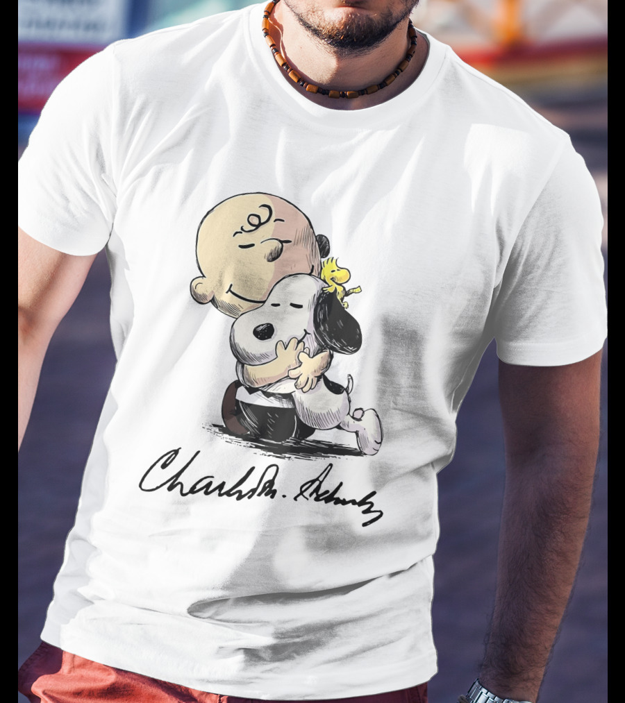 Snoopy And Charlie Brown Hugging By Charles M. Schulz T-Shirt