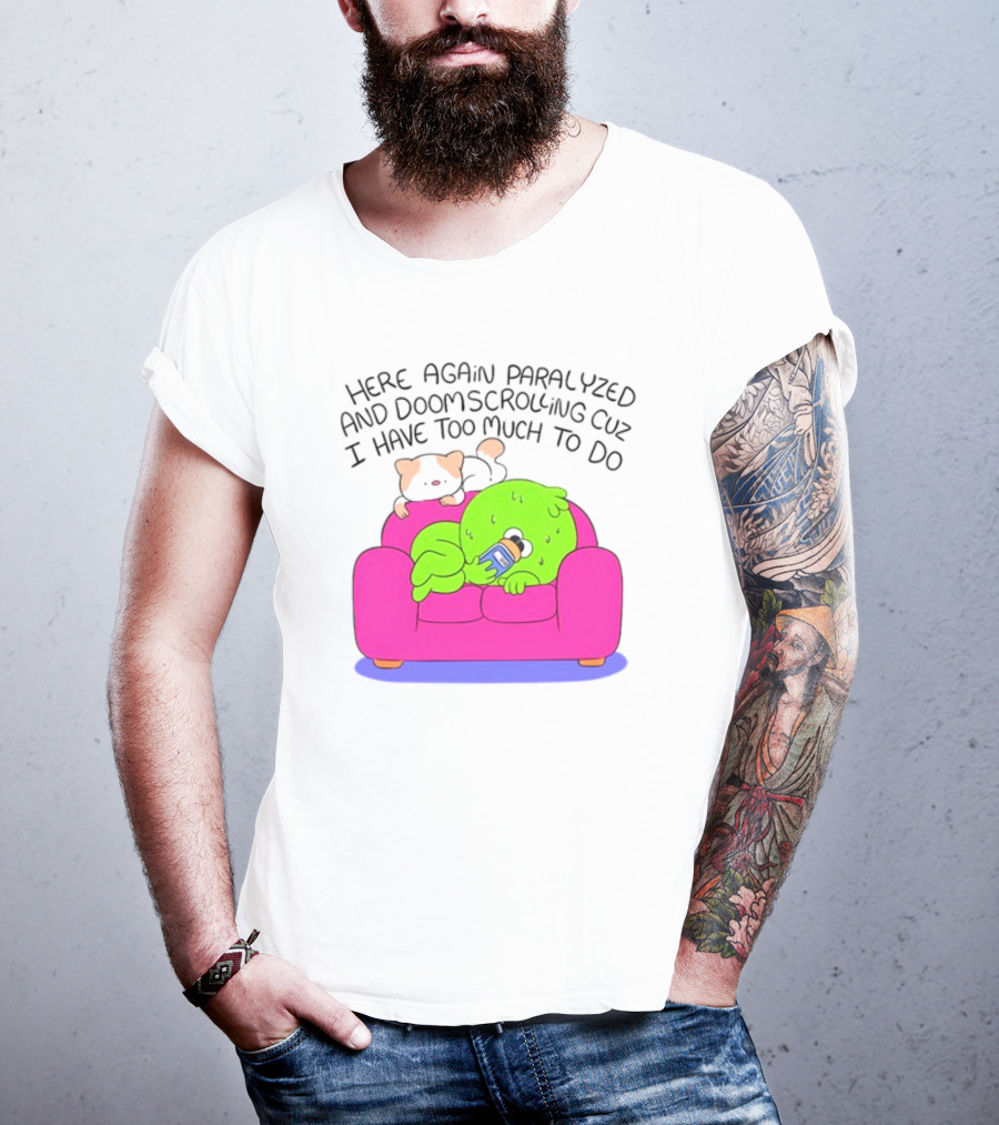 Here Again Paralyzed And Doomscrolling Cuz I Have Too Much To Do Quirky Green Figure Relaxing On Pink Couch With Cute Dog T-Shirt