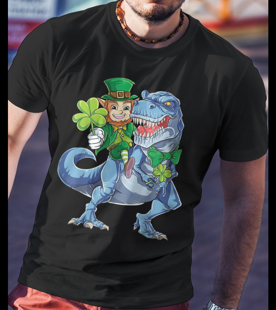 Leprechaun With Shamrock And Bowtie Riding T-Rex Dinosaur T-Shirt