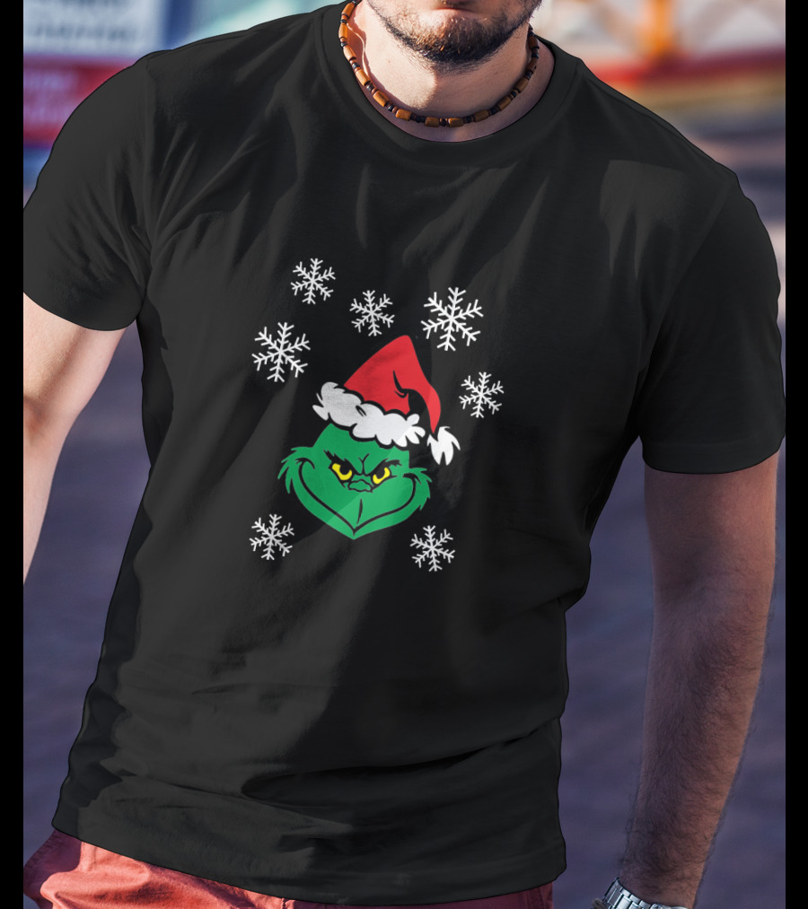 Grinch Face With Santa Hat Surrounded By Snowflakes Iconic Holiday Character T-Shirt