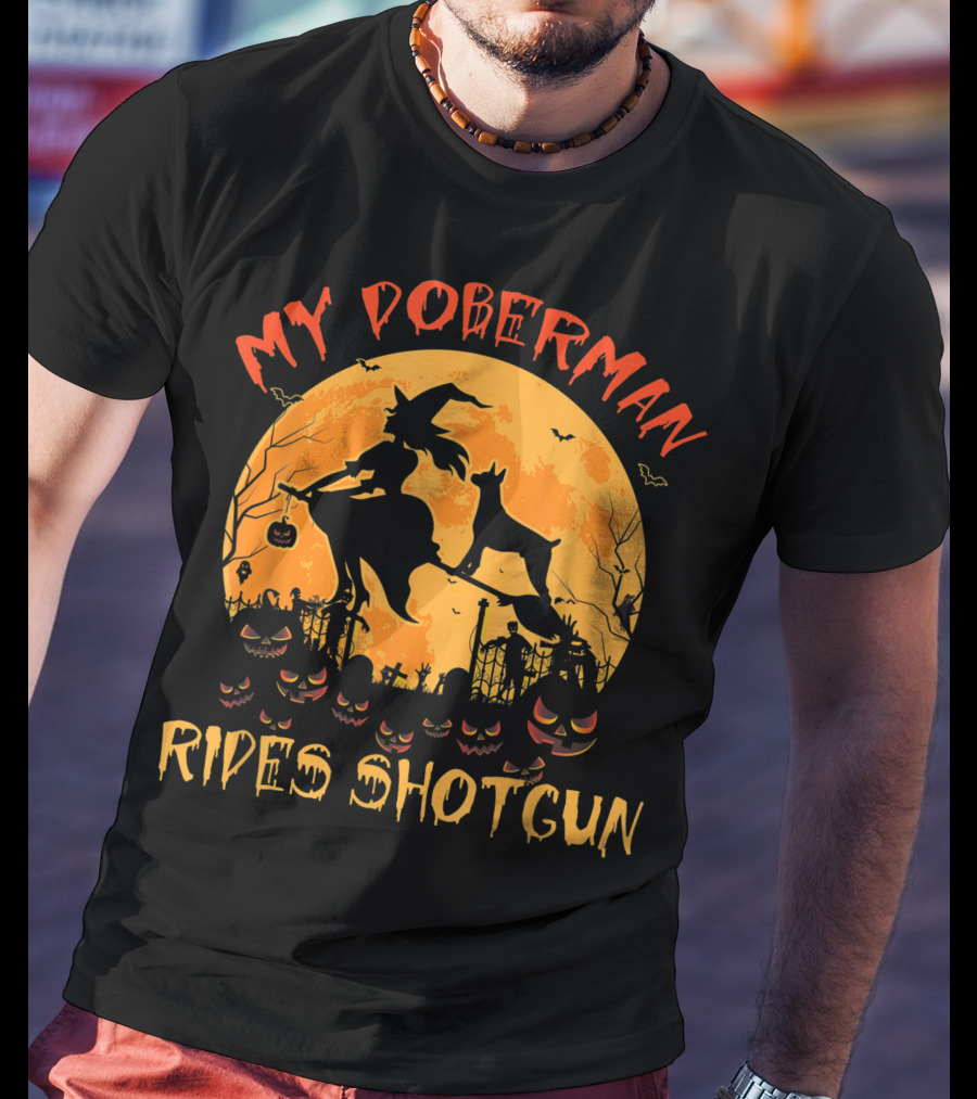 My Doberman Rides Shotgun Halloween Witch And Pumpkins Moon Scene T-Shirt