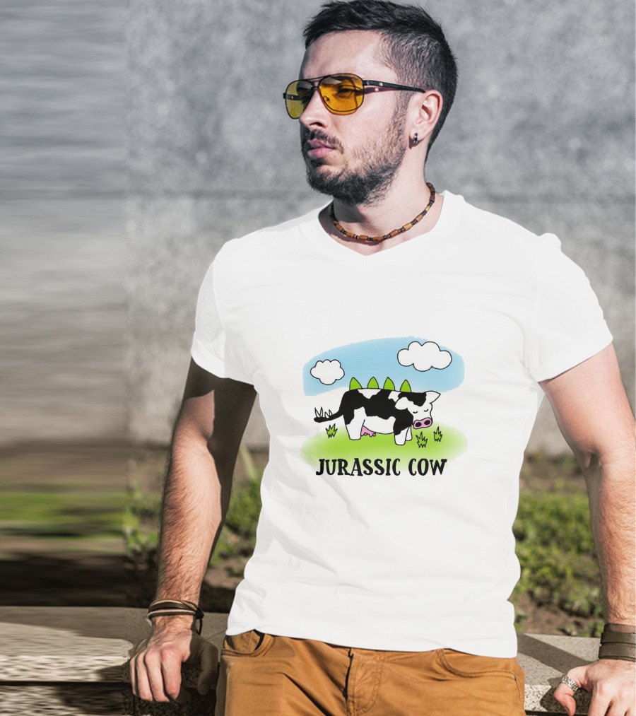 Jurassic Cow Grazing With Dinosaur Spikes Under Blue Sky And Clouds In Cartoon T-Shirt