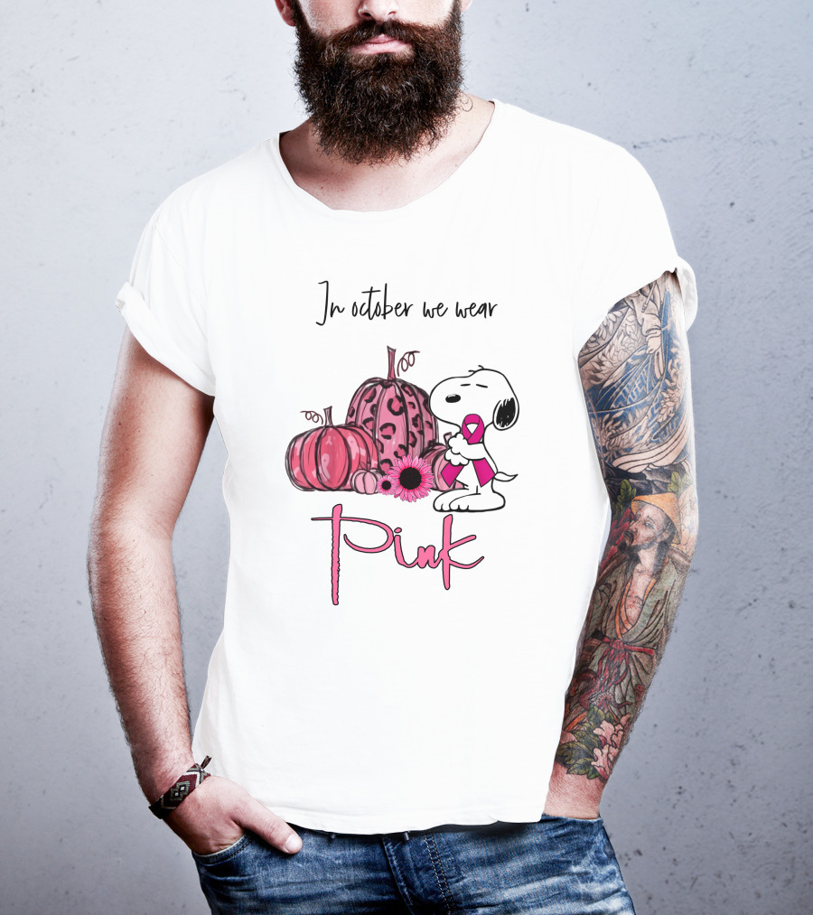 In October We Wear Pink With Peanuts Character Holding Ribbon And Pumpkins T-Shirt