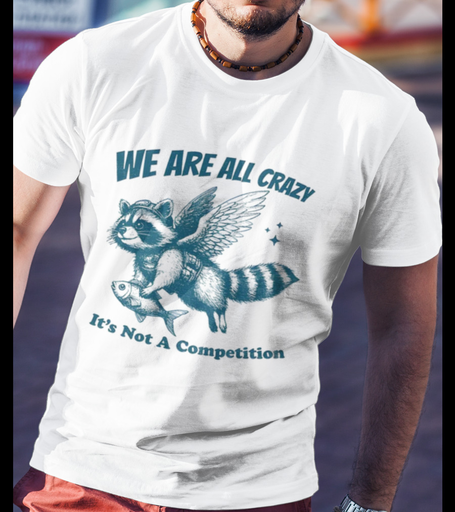 Raccoon With Wings Holding Fish We Are All Crazy It's Not A Competition T-Shirt