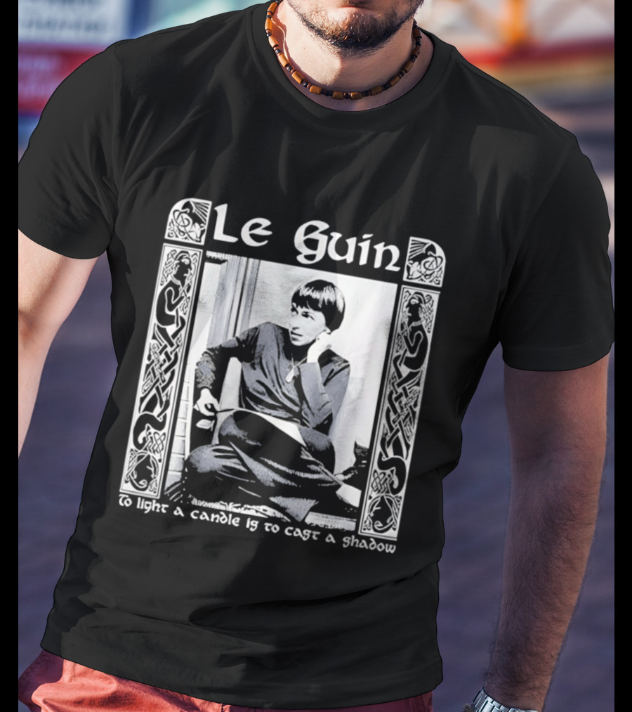 Le Guin To Light A Candle Is To Cast A Shadow T-Shirt
