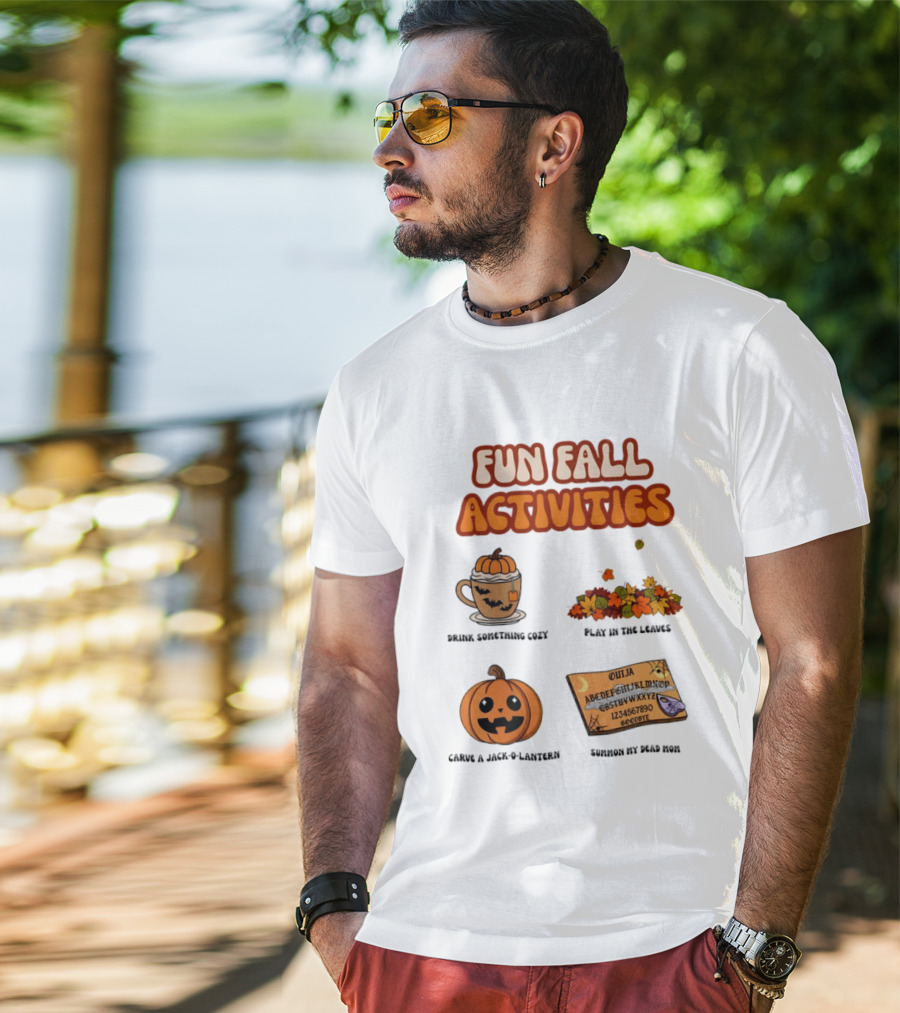 Fun Fall Activities Halloween Drink Something Cozy Ouija Board Carve A Jack O Lantern Play In The Leaves T-Shirt