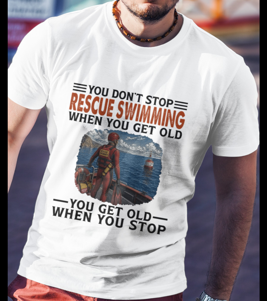You Don't Stop Rescue Swimming When You Get Old You Get Old When You Stop Rescue Swimmer Standing On Boat Near Lighthouse T-Shirt