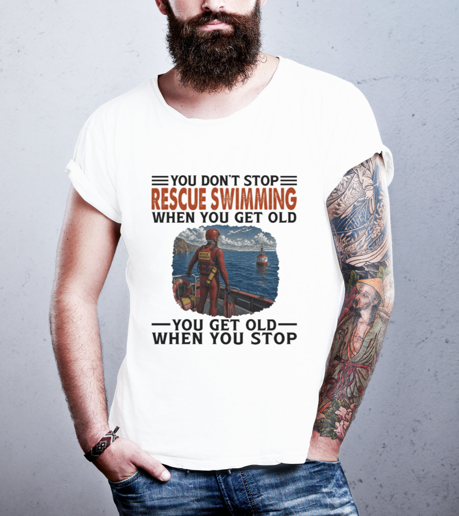 You Don't Stop Rescue Swimming When You Get Old You Get Old When You Stop Rescue Swimmer Standing On Boat Near Lighthouse T-Shirt