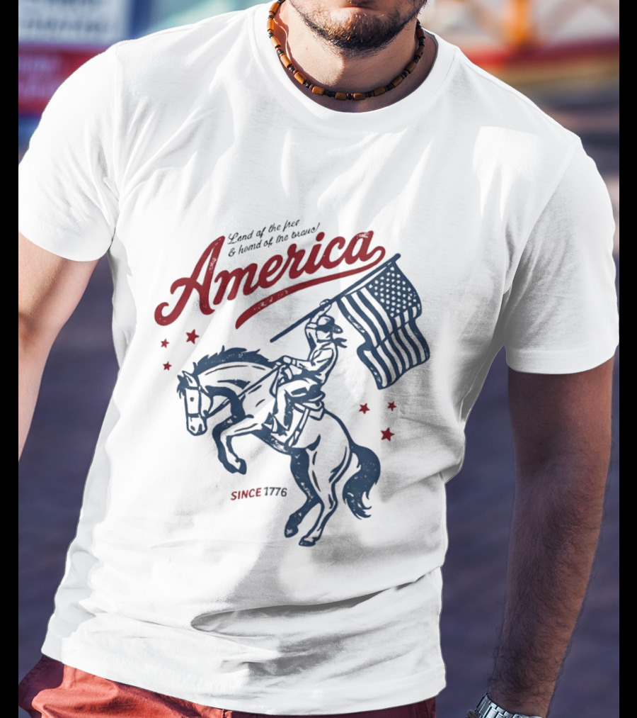 America Land Of The Free Home Of The Brave Since 1776 Cowboy Holding Flag Patriotic T-Shirt