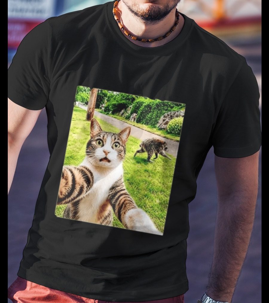 Shocked Face Tabby Cat Taking Selfie With Running Raccoon On Lawn Road T-Shirt
