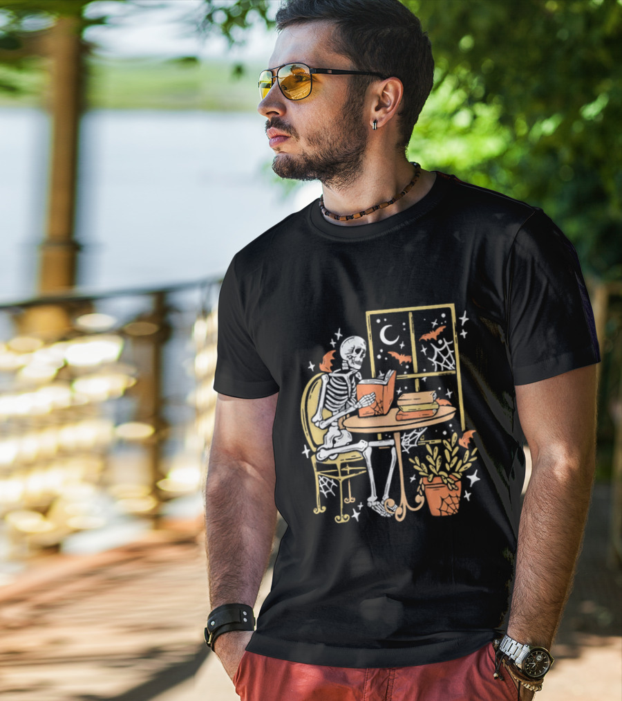 Cartoon Skeleton Reading Under Crescent Moon With Bats Orange Book Table Window T-Shirt