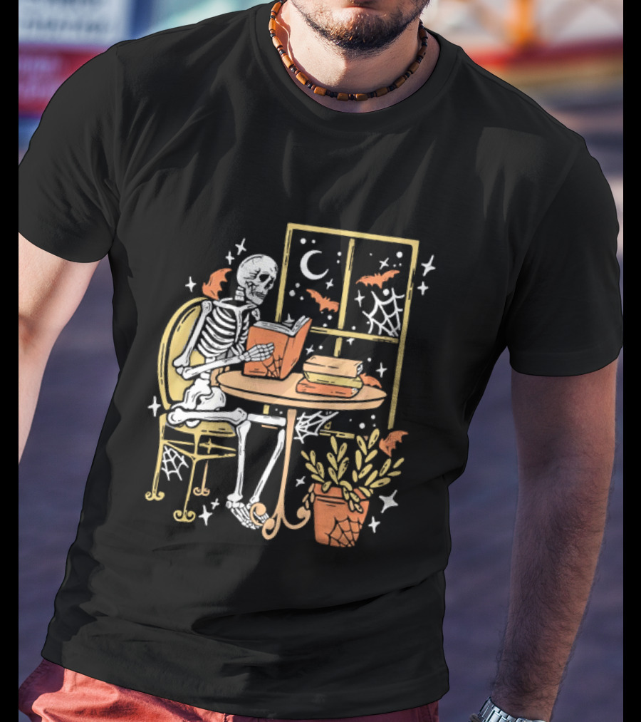 Cartoon Skeleton Reading Under Crescent Moon With Bats Orange Book Table Window T-Shirt