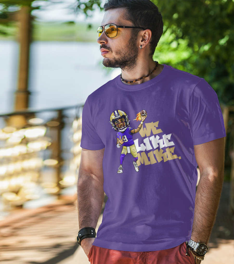 We Like Mike Football Character In Purple And Gold Gear Holding Flaming Ball T-Shirt