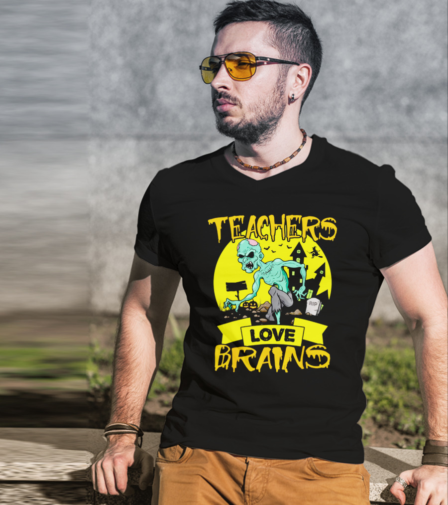 Teachers Love Brains Zombie Halloween Theme With Haunted Houses And Graveyard Background T-Shirt