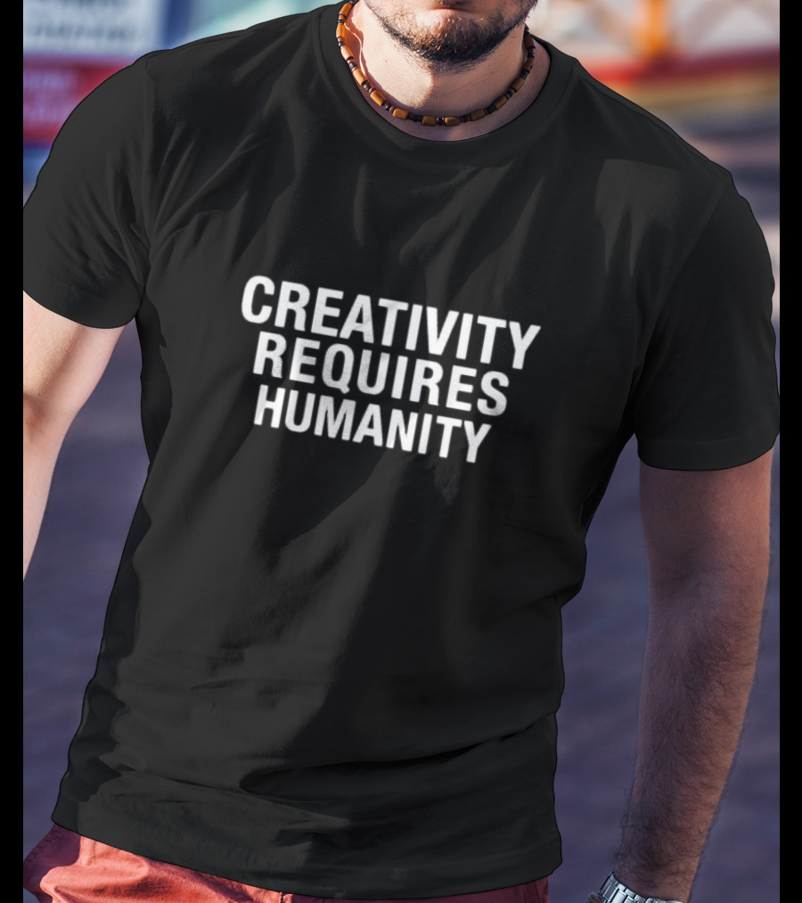 CREATIVITY REQUIRES HUMANITY Textual Emphasis In Bold White Letters T-Shirt