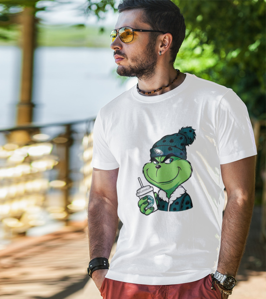 Grinch Holding Cup Wearing Philadelphia Eagles Beanie T-Shirt