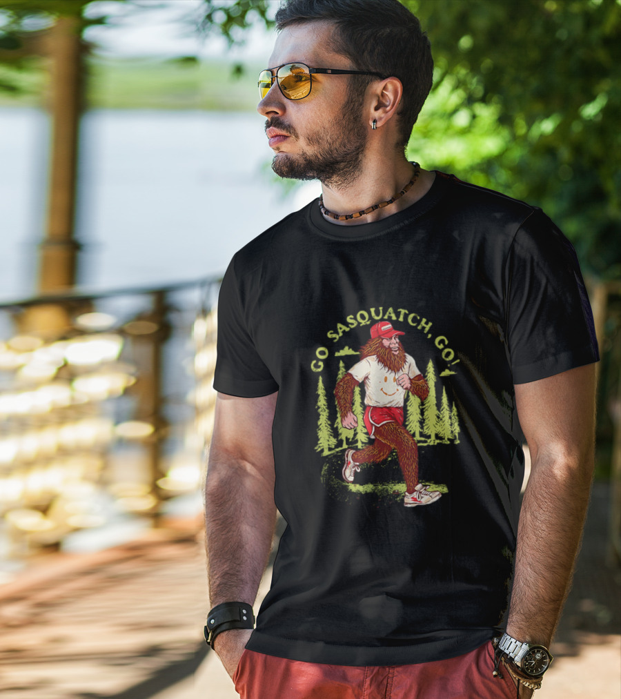 Go Sasquatch Go Bigfoot Jogging In Forest With Red Cap And Sneakers T-Shirt