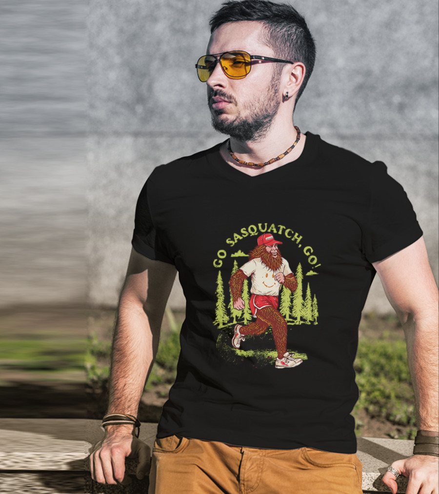 Go Sasquatch Go Bigfoot Jogging In Forest With Red Cap And Sneakers T-Shirt