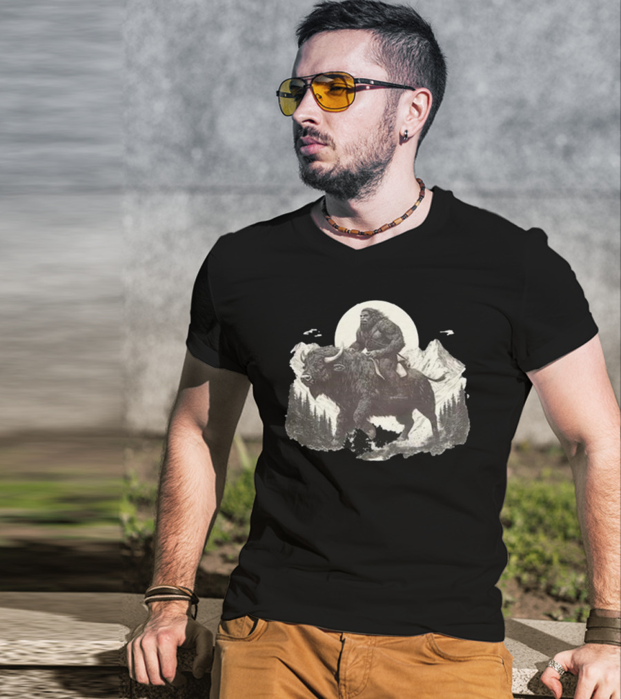 Blurry Creatures Bigfoot Riding Buffalo With Mountains And Moon In Background T-Shirt