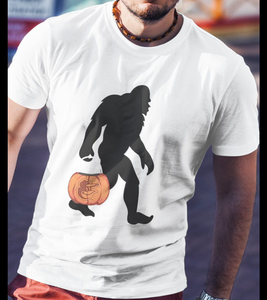 Baltimore Orioles Bigfoot Carrying Pumpkin Halloween T-Shirt