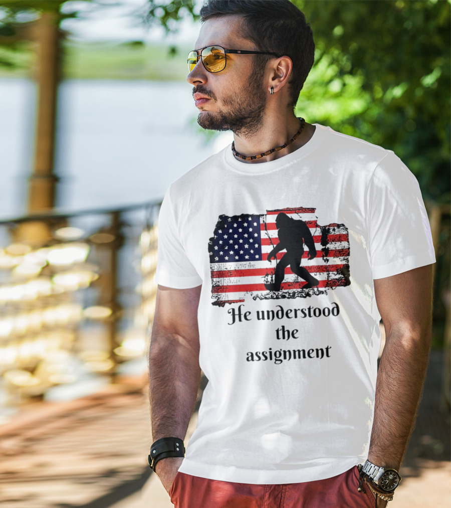 Bigfoot Silhouette With Distressed American Flag He Understood The Assignment T-Shirt