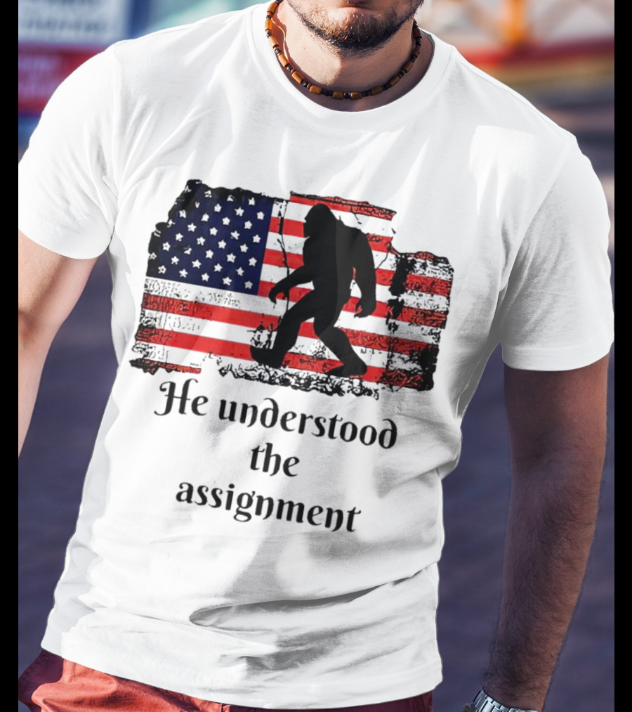 Bigfoot Silhouette With Distressed American Flag He Understood The Assignment T-Shirt