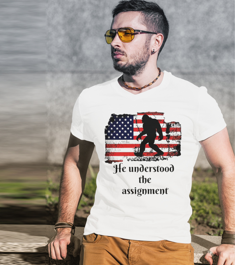 Bigfoot Silhouette With Distressed American Flag He Understood The Assignment T-Shirt