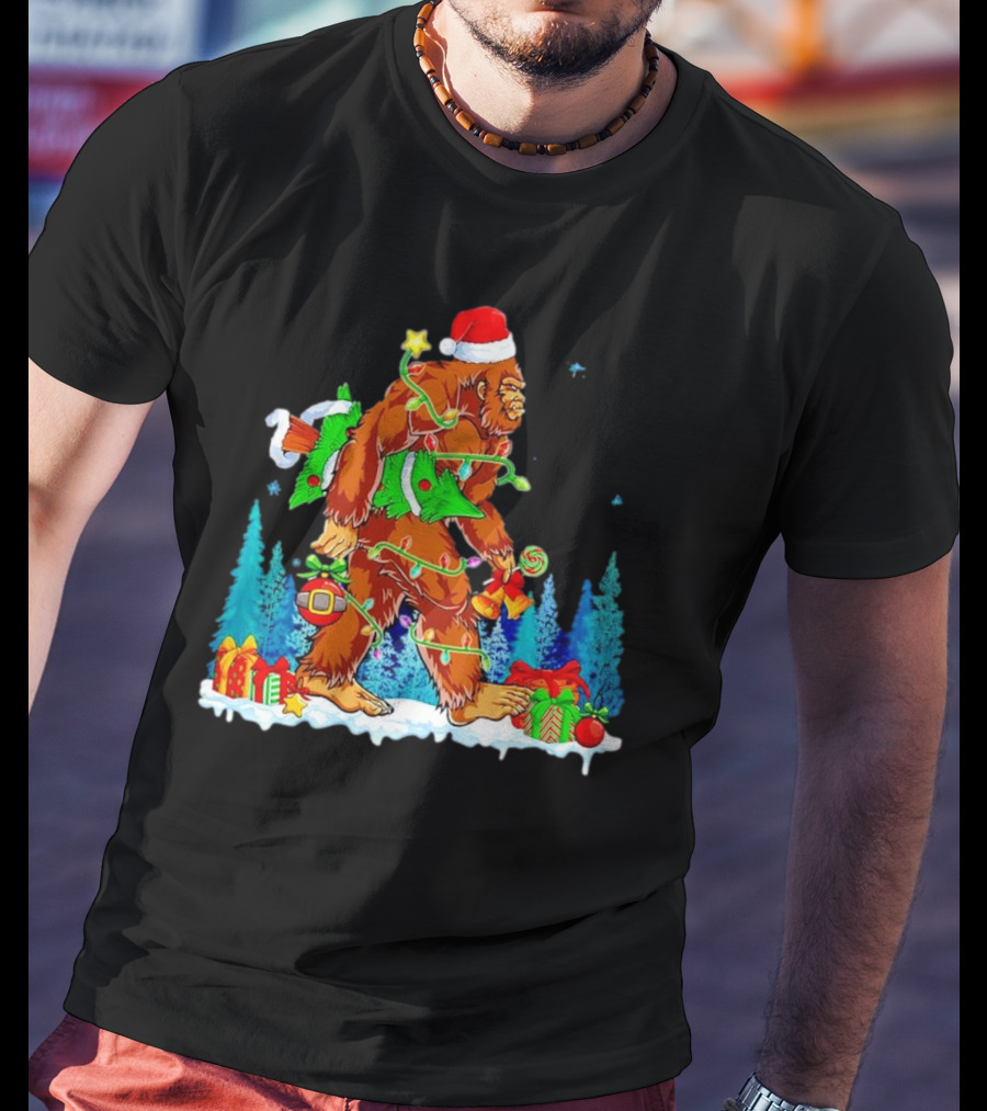 Bigfoot Santa Hugging Christmas Tree With Gifts And Snow Scene T-Shirt