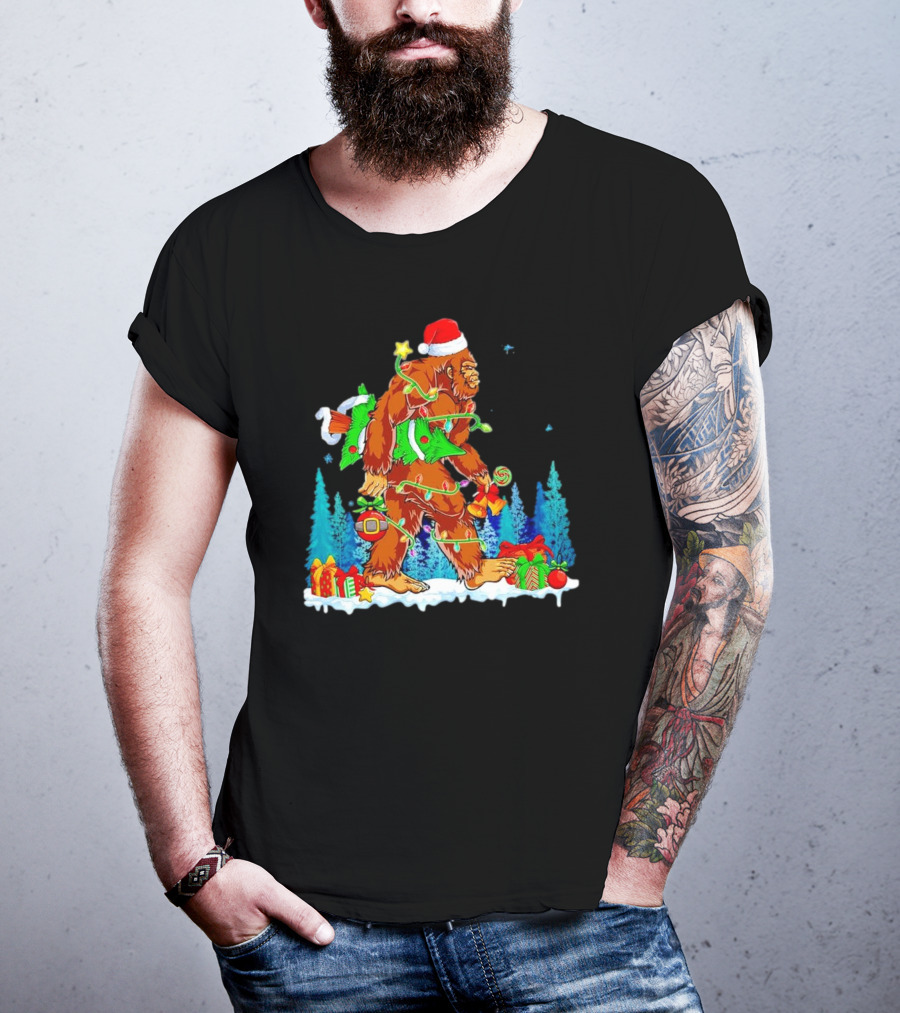 Bigfoot Santa Hugging Christmas Tree With Gifts And Snow Scene T-Shirt