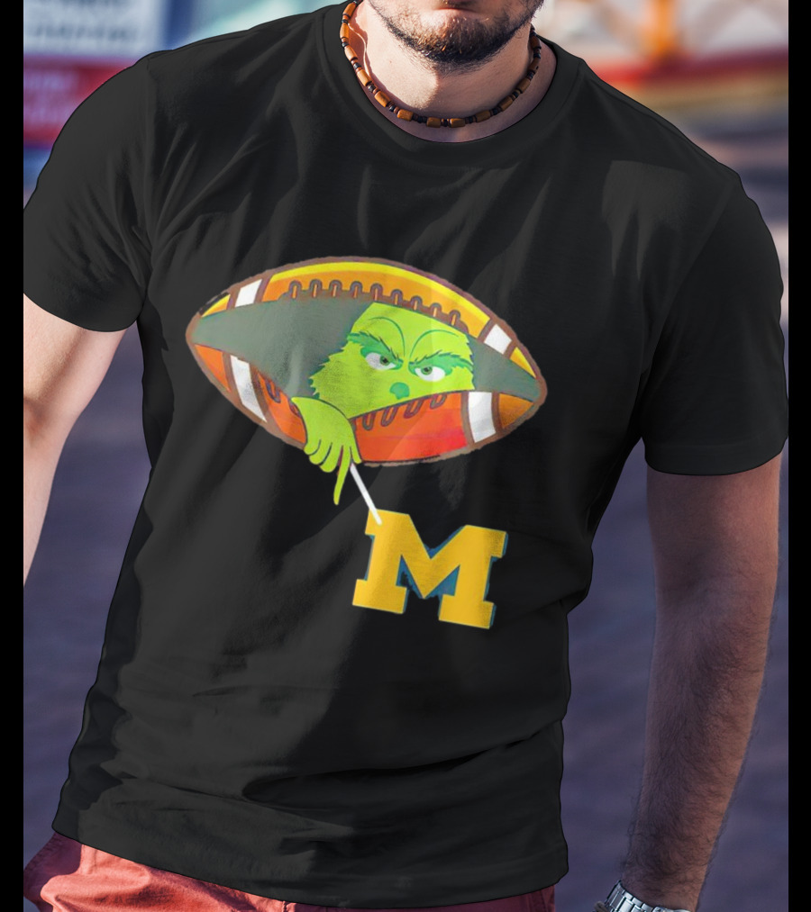 Grinch Peeking From Football Over Michigan Wolverines T-Shirt