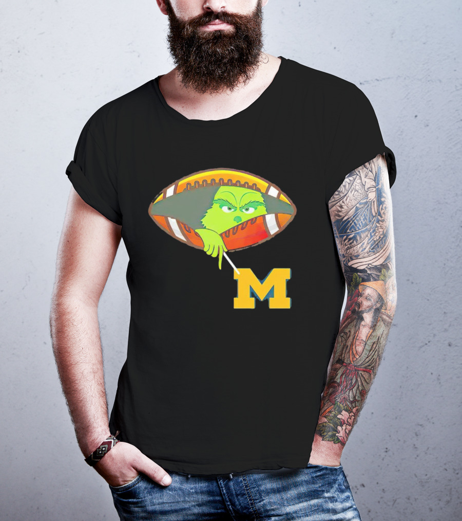 Grinch Peeking From Football Over Michigan Wolverines T-Shirt
