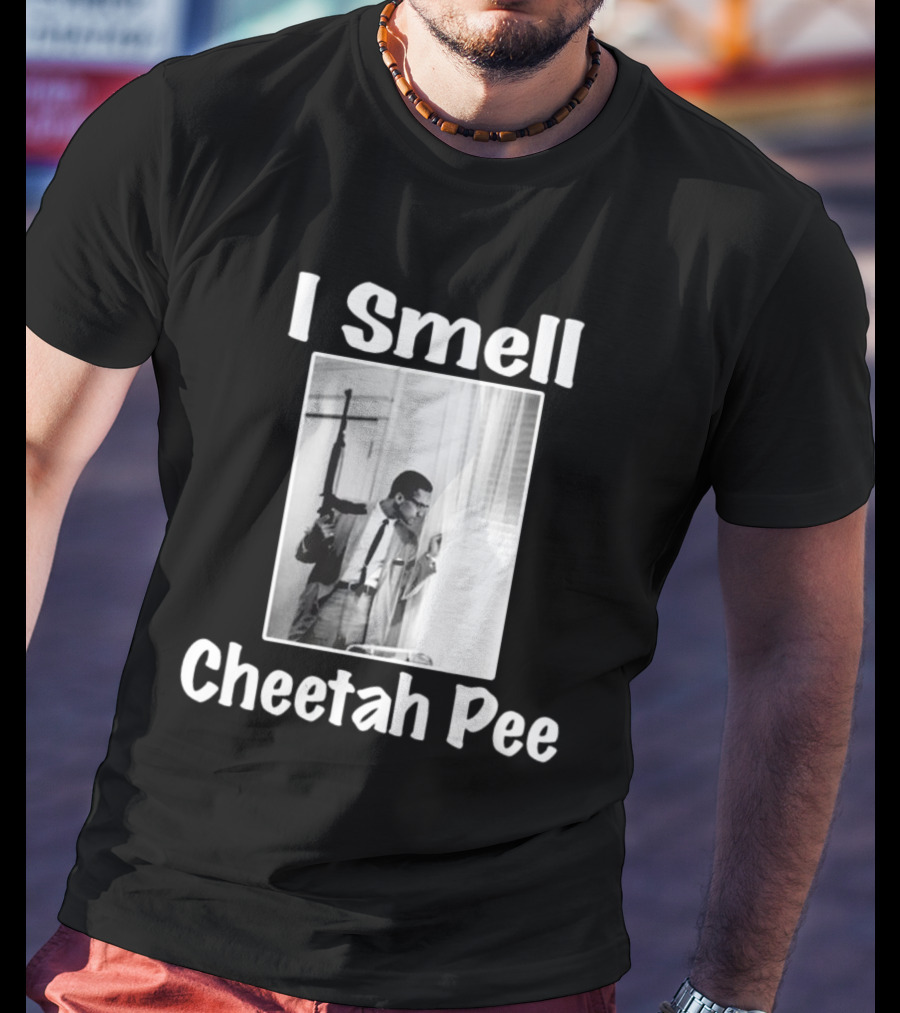 I Smell Cheetah Pee Man Holding Gun By Window T-Shirt