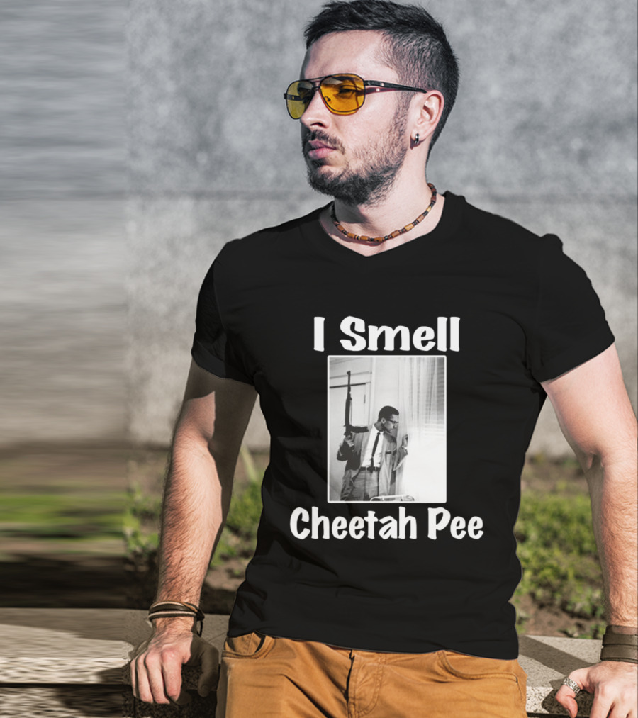 I Smell Cheetah Pee Man Holding Gun By Window T-Shirt