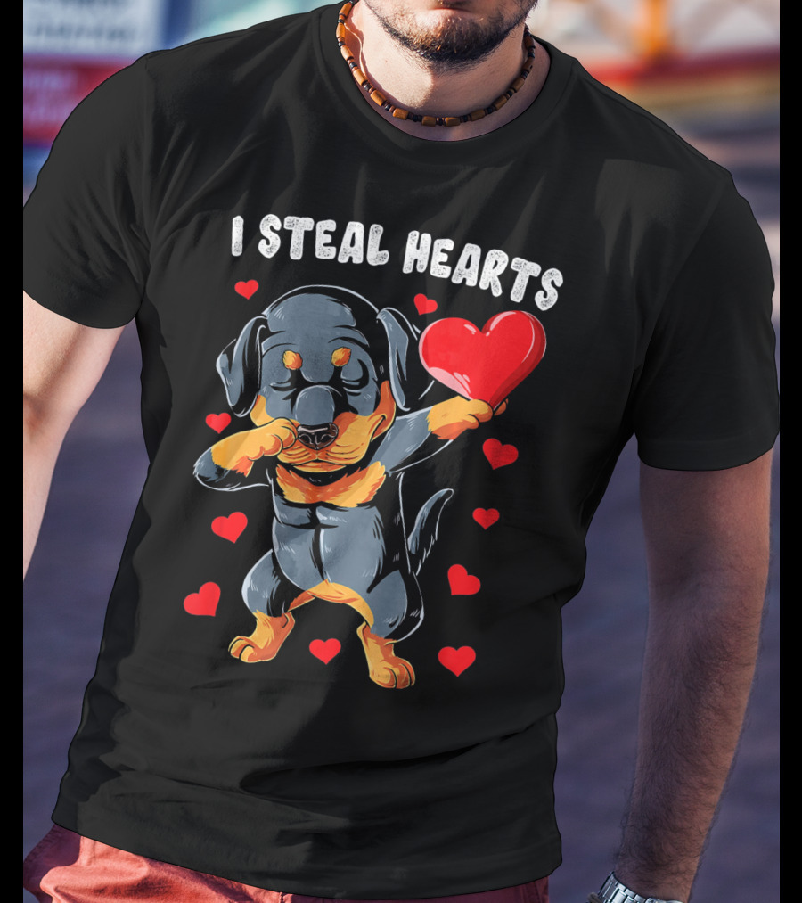 Dabbing Rottweiler Holding Heart Surrounded By I Steal Hearts Text T-Shirt