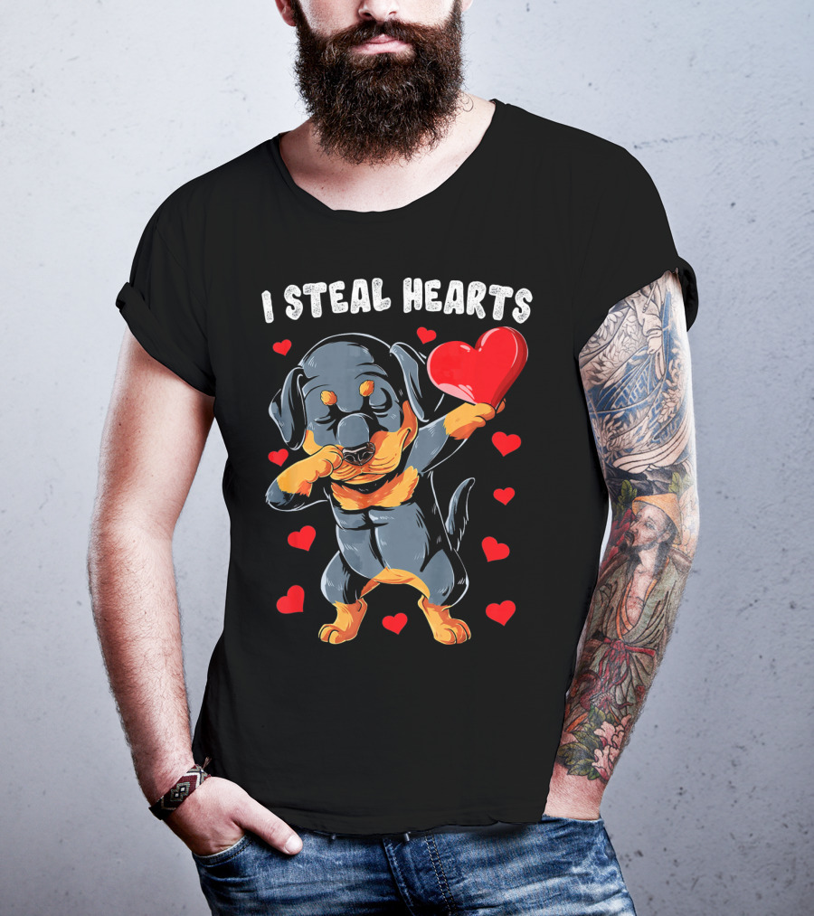 Dabbing Rottweiler Holding Heart Surrounded By I Steal Hearts Text T-Shirt